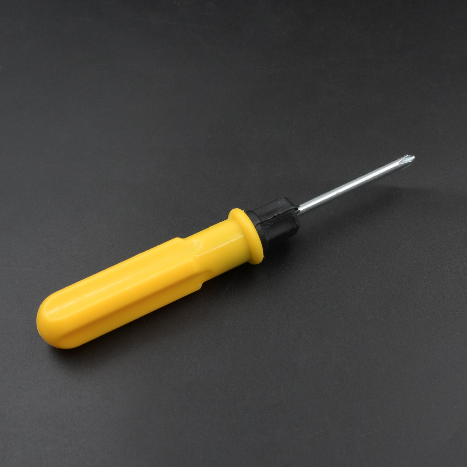 Magnetic screwdriver with slotted and cross head tips