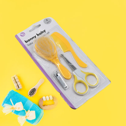 4-piece baby safety and grooming kit featuring nail clippers, a brush, comb, and scissors.