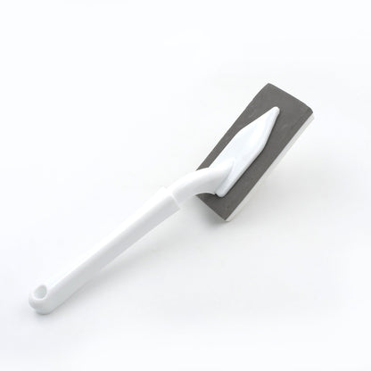 Versatile kitchen and bathroom cleaning brush with triangle design