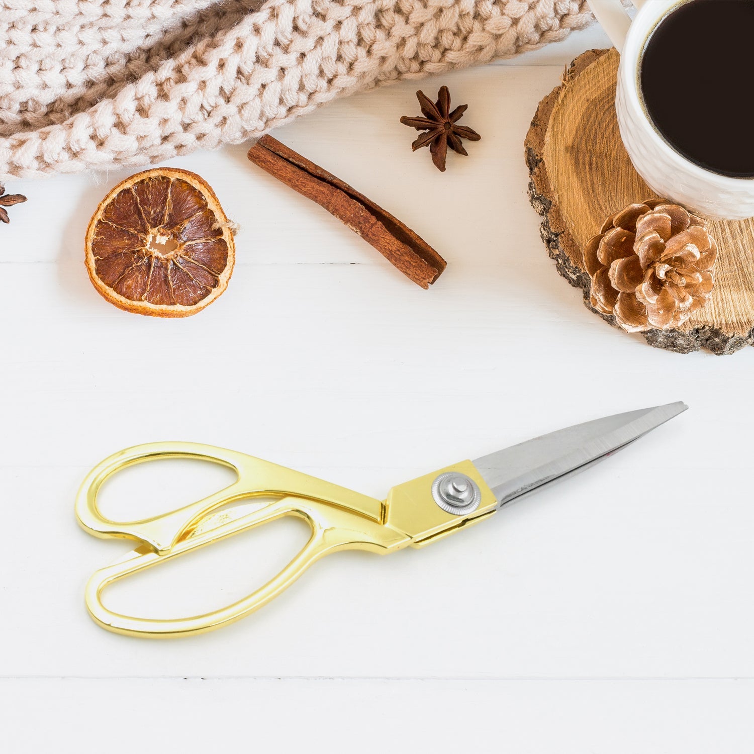 Close-up of stainless steel tailoring scissors showing sharp blades.