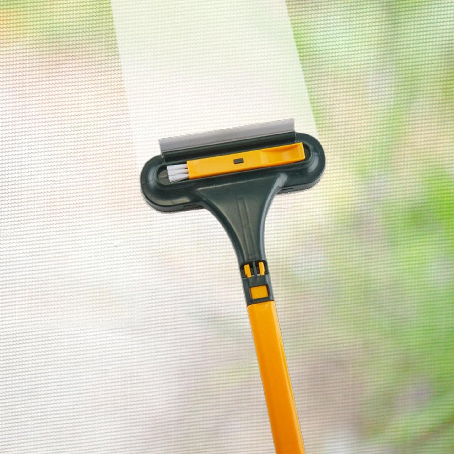 Mesh and glass cleaning squeegee with brush, compact and easy to use for home cleaning.